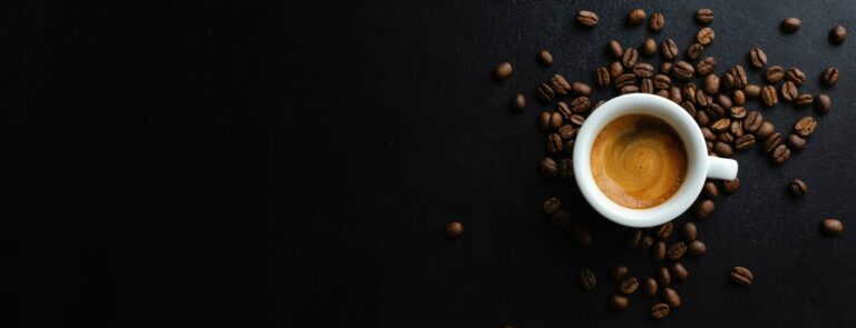 Rubica Coffee tasty-espresso-served-cup-with-coffee-beans-around-spoon-view-from-dark-background-banner (1)-min