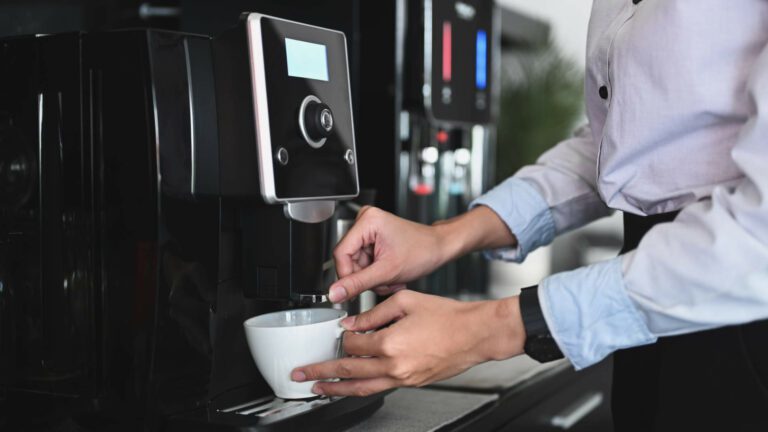 Enhance Your Coffee Experience with The Best Coffee Machine Rental in South Africa - Rubica Coffee - Man making coffee on Mythos Coffee machine